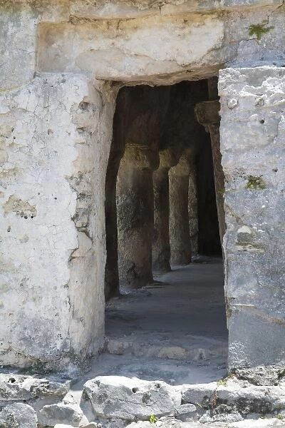 Cancun, Quintana Roo, Mexico - An ancient, carved doorway leading inside a stone structure