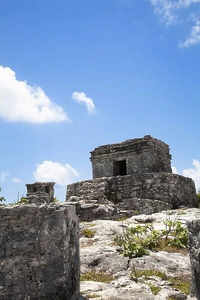 Cancun, Quintana Roo, Mexico - Low angle view of an ancient stone structure on the top of a hill