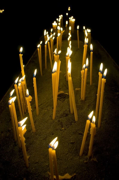 Candles burning in the Armenian orthodox church at Geghard monastery near Garni