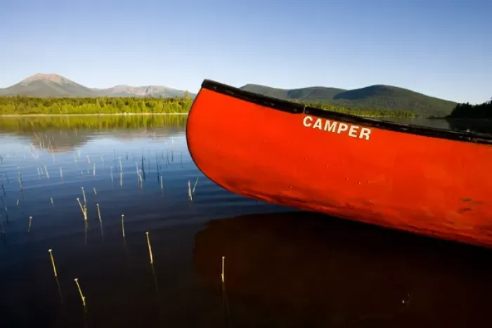 Framed Print : A canoe in early morning on Maines Katahdin Lake. Mount Katahdin is in the distance