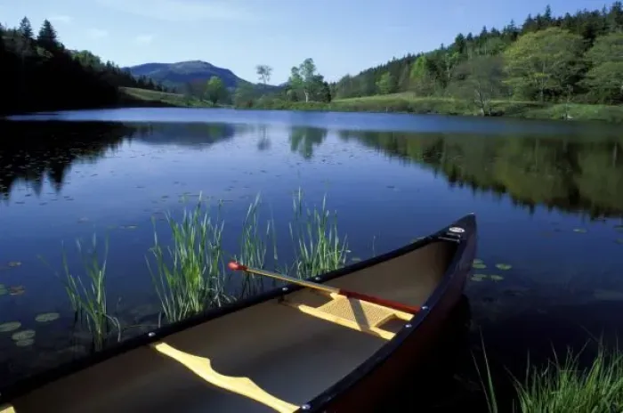 Framed Print : A canoe rests on the shore of Little Long Pond at Acadia National Park, Maine