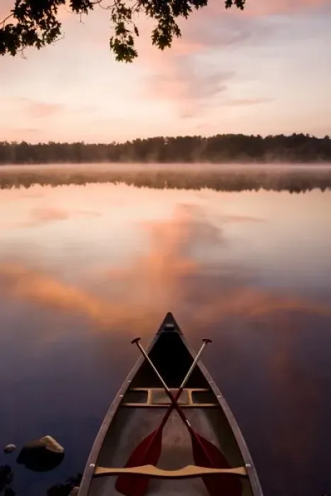 Framed Print : A canoe rests on the shore of Pawtuckaway Lake at dawn as seen from Horse Island Framed Print : A canoe rests on the shore of Pawtuckaway Lake at dawn as seen from Horse Island