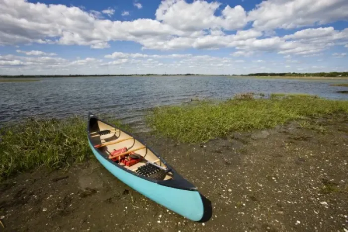 Framed Print : A canoe on the salt marsh side of Long Beach in Stratford, Connecticut. This body