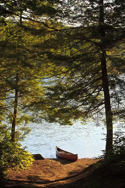 Canoe on the shore next to Zack Woods Pond in Hyde Park, Vermont