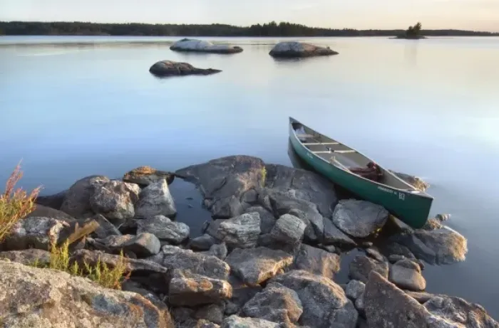 Framed Print : Canoe at sunset from rock island off the shore of Round Bear Island, Kabetogama Lake