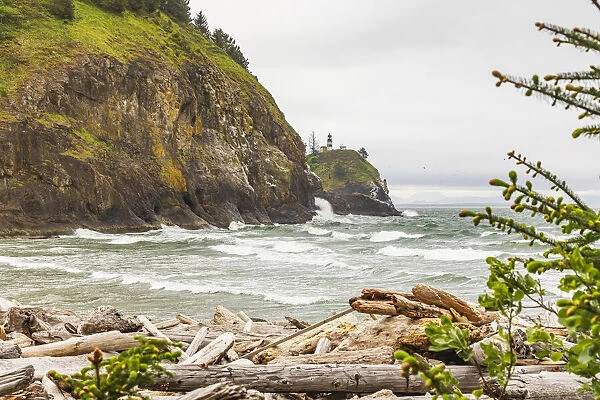 Cape Disappointment State Park, Washington State, USA. Surf crashing on the rocks at Cape Disappointment State Park