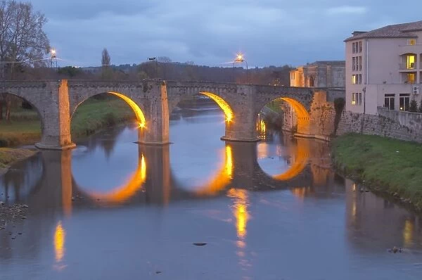 Carcassonne. Languedoc. The old bridge across the Aude river. Illuminated in early morning
