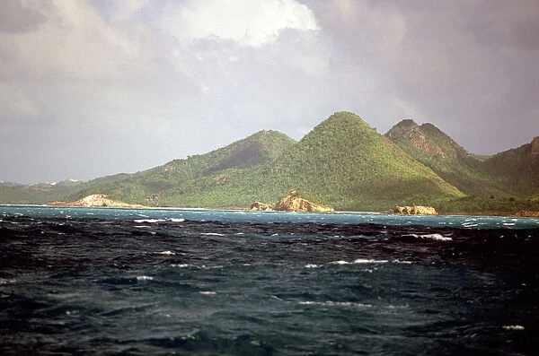 Caribbean, Antigua. Peaks of Antigua viewed from the sea