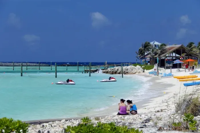 Framed Print : Caribbean, Bahamas, Castaway Cay. Women on beach at Castaway Cay