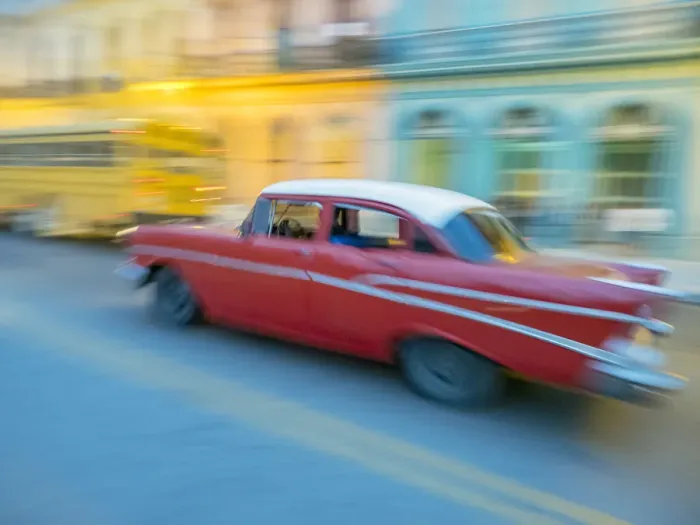 Framed Print : Caribbean, Cuba, Havana, Havana Vieja, UNESCO World Heritage Site, classic car in motion