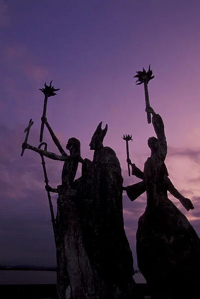 CARIBBEAN, Puerto Rico Slender statues on coatline at dusk