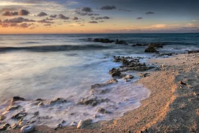 Framed Print : Caribbean Sea, Cayman Islands. Crashing waves at sunset on the shore near George Town