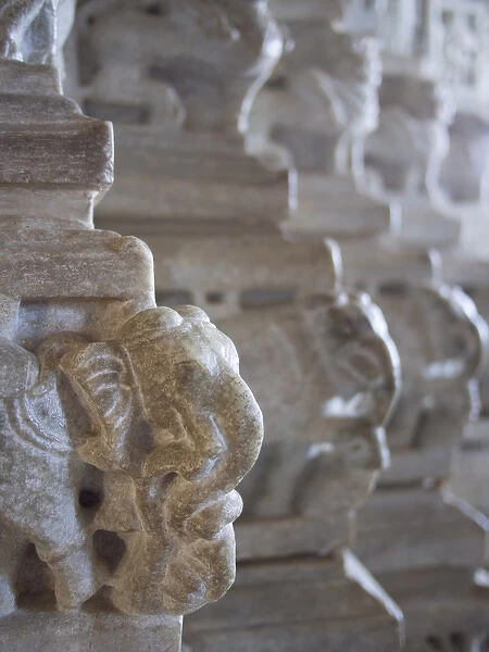 Carved elephant sculpture on columns of temple at Ranakpur, Rajasthan, India