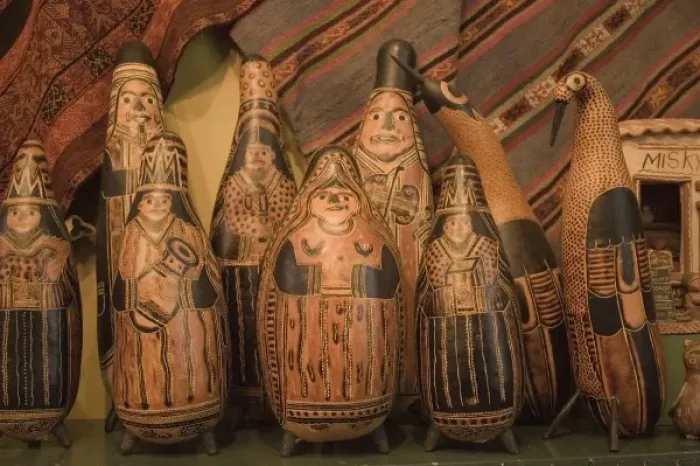 Framed Print : Carved gourds and other folk art on display in shop. Peru, Lima