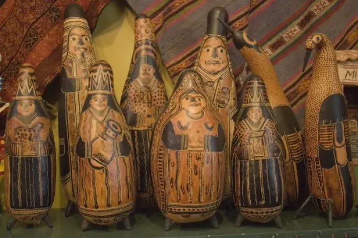 Framed Print : Carved gourds and other folk art on display in shop. Peru, Lima