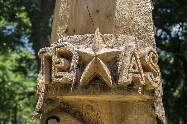 Carved totem pole art with Texas star, Wimberley, Texas, USA, For Editorial Use Only