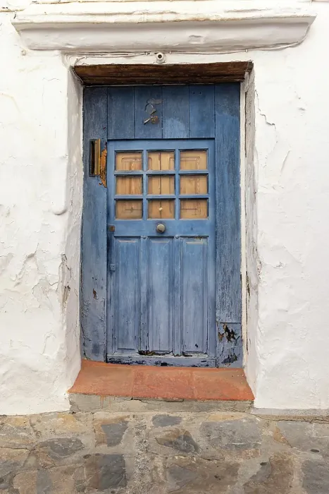 Framed Print : Casares, Malaga, Andalusia, Spain. A weather blue door on a white stucco house Framed Print : Casares, Malaga, Andalusia, Spain. A weather blue door on a white stucco house