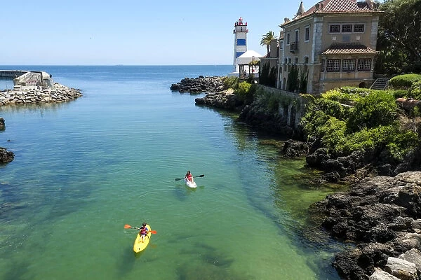 Cascais, Portugal. Kayaking in the waterway neat the palace