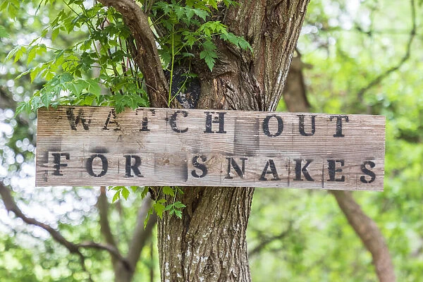 Castroville, Texas, USA. Sign warning snakes in the Texas Hill Country