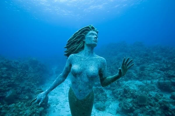 Cayman Islands, Grand Cayman Island, Underwater view mermaid sculpture in shallow
