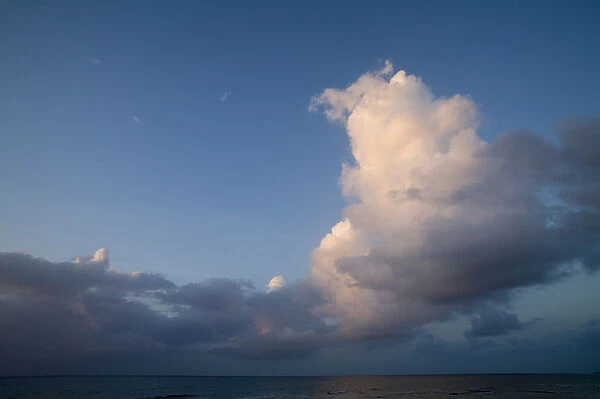 Cayman Islands, Little Cayman Island, Sunset lights clouds above Caribbean Sea