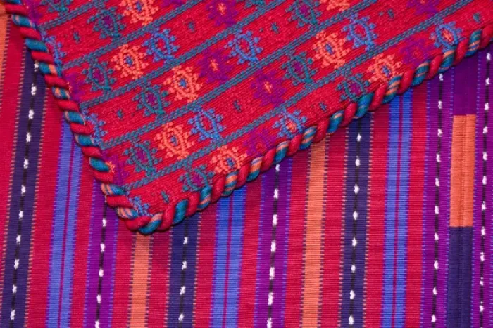 Framed Print : Central America, Guatemala, Antigua. Colorful weavings for sale in shop in Antigua