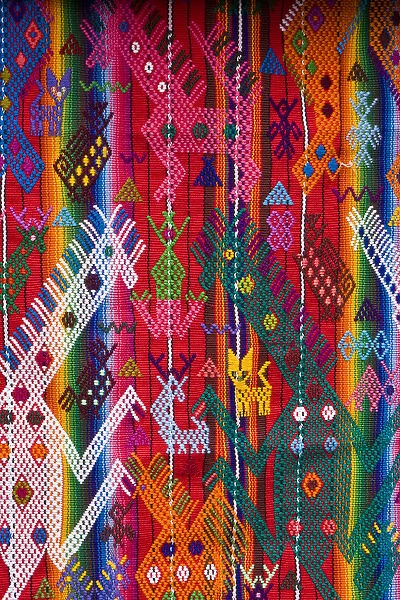Central America, Guatemala, Chichicastenango. Closeup of embroidered weaving at