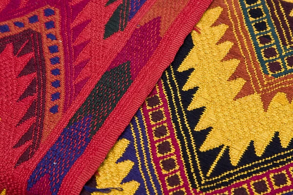 Central America, Guatemala, Chichicastenango. Traditional textiles on display at