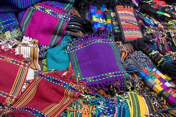 Central America, Guatemala, Chichicastenango. Traditional textiles on display at