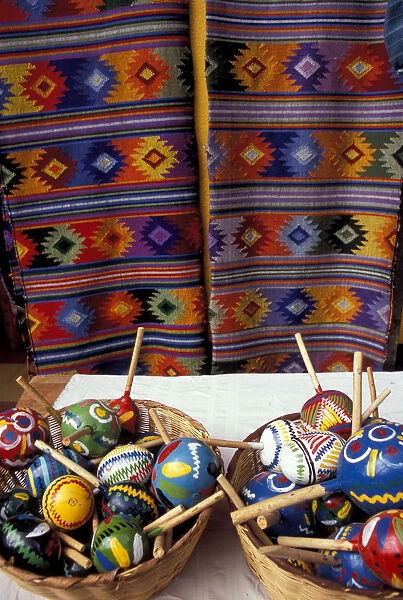 Central America, Guatemala, Highlands, Chichicastenango. Shakers and woven cloth