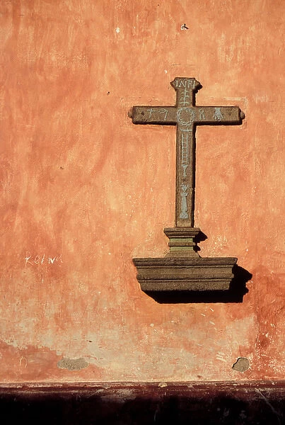 Central America, Guatemala, Highlands, Antigua. Cross on a building in center of town