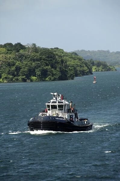Central America, Panama, Panama Canal. Tug boat that helps ships transit the Panama Canal