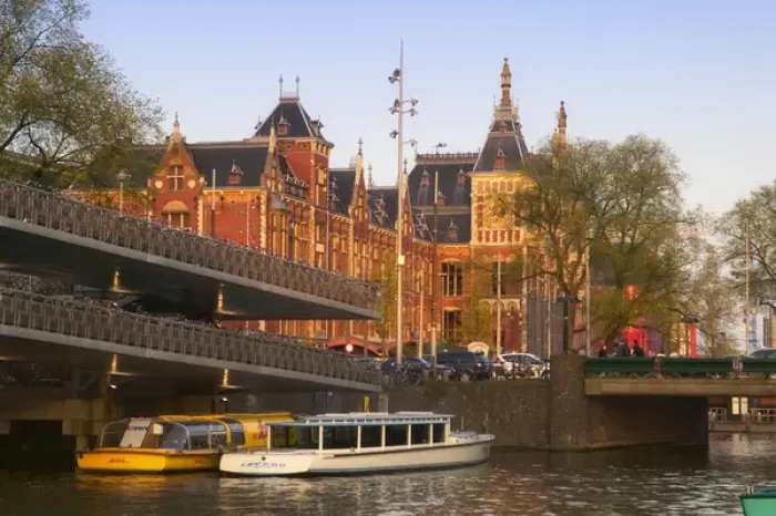 Framed Print : Central Station by the canal, Amsterdam, Netherlands