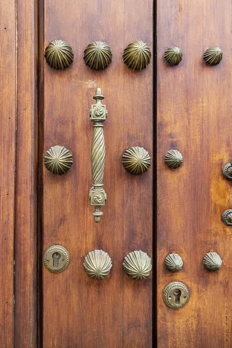 Framed Print : Centro District, Cordoba, Andalusia, Spain. Brass handle and decorations on an old Spanish building Framed Print : Centro District, Cordoba, Andalusia, Spain. Brass handle and decorations on an old Spanish building
