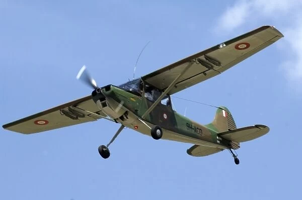 Cessna OE-1 Bird Dog at CAF Air Show showing Maltese markings in the sky