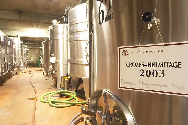 In the Chapoutier winery. Stainless steel fermentation tanks, one with Crozes Hermitage