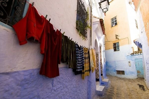 Chefchaouen Morocco laundry hanging on a wall in the medina