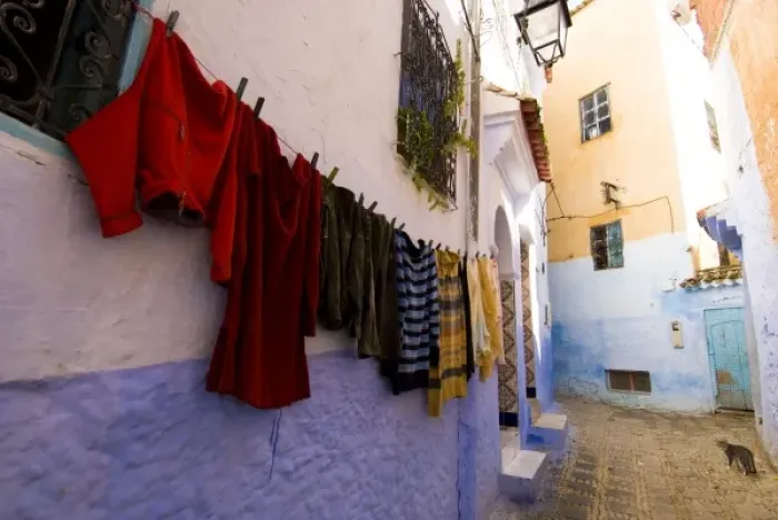Framed Print : Chefchaouen Morocco laundry hanging on a wall in the medina Framed Print : Chefchaouen Morocco laundry hanging on a wall in the medina