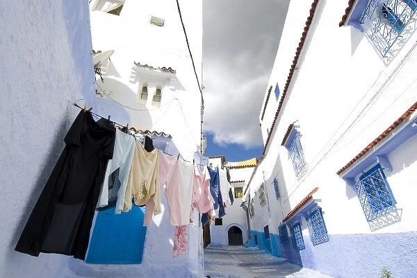 Chefchaouen Morocco laundry hanging against the white and blue washed wall in the medina
