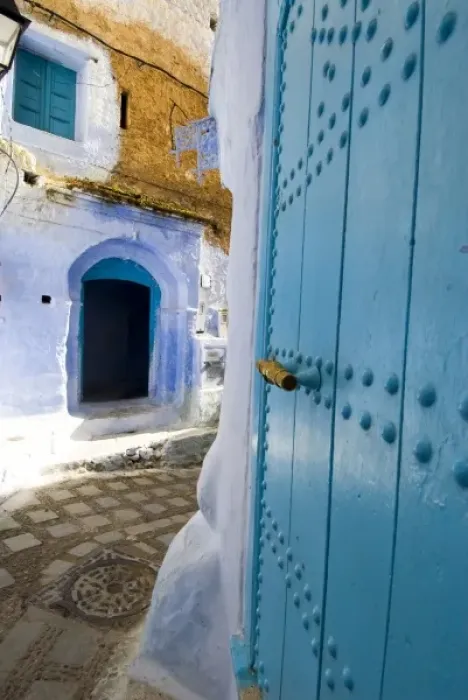 Framed Print : Chefchaouen Morocco narrow street with blue doors in the medina Framed Print : Chefchaouen Morocco narrow street with blue doors in the medina