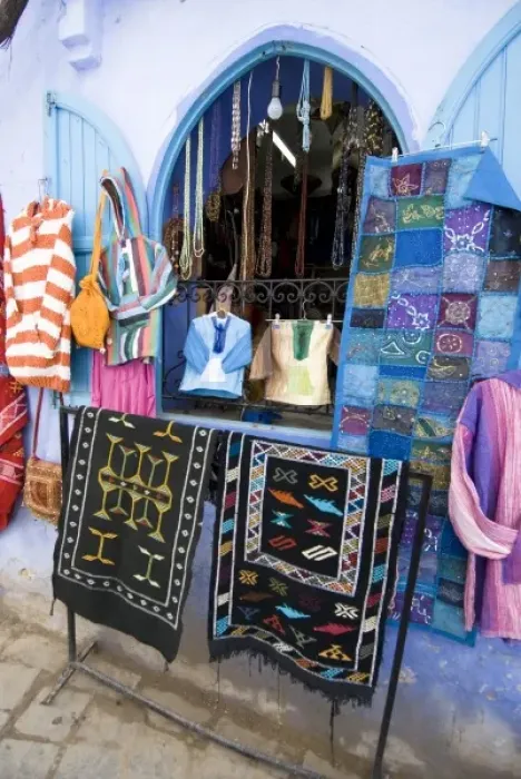 Framed Print : Chefchaouen Morocco tourist shop selling clothes, bags, rugs and wall hangings in
