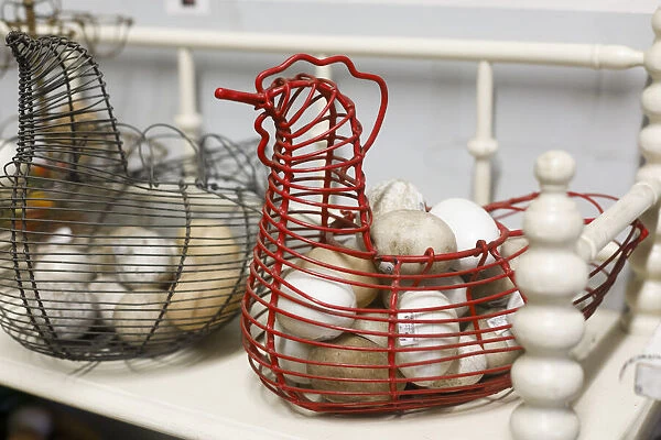 Chicken-shaped metal baskets holding rocks