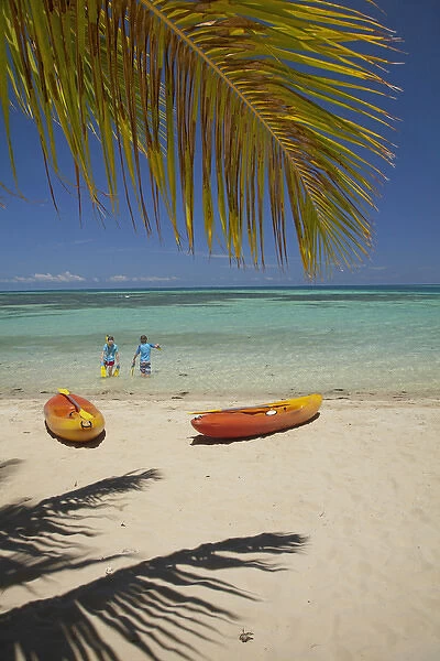 Children, kayaks and palm frond, Plantation Island Resort, Malolo Lailai Island, Mamanuca Islands