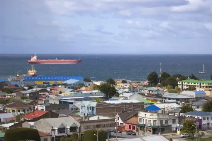 Framed Print : Chile, Patagonia, Punta Arenas. A large tanker off the coast with city in foreground Framed Print : Chile, Patagonia, Punta Arenas. A large tanker off the coast with city in foreground