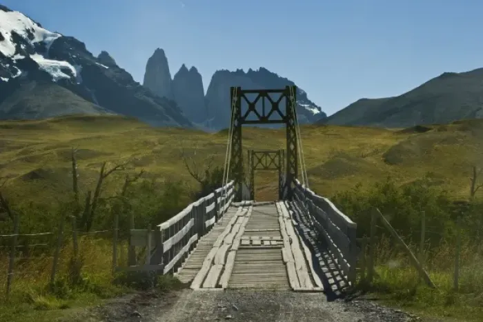 Framed Print : Chile, Patagonia, Torres del Paine National Park. A narrow wooden bridge allows