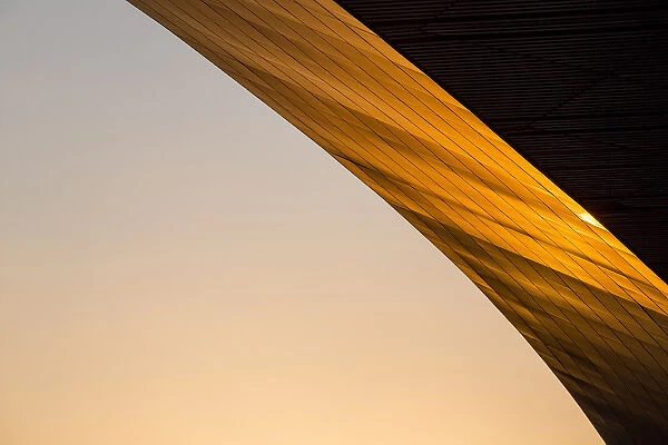 China, Beijing, Setting sun lights curved exterior roof line at Beijing International
