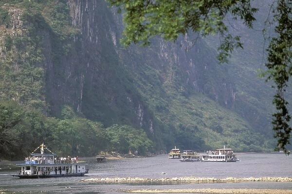 China, Guangxi. Guilin Li river cruise. River cruise boats