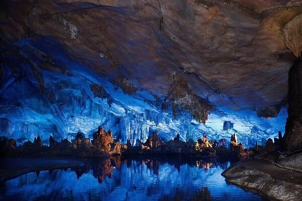 China, Guilin, Reed Flute Cave illuminated colorful natural formations