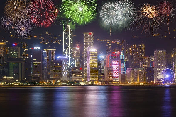 China, Hong Kong. Fireworks over city at night