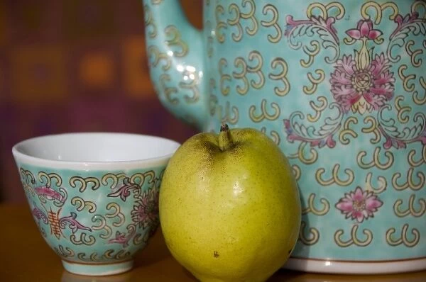 China, Hong Kong. Traditional Chinese teapot & cup with Chinese pear